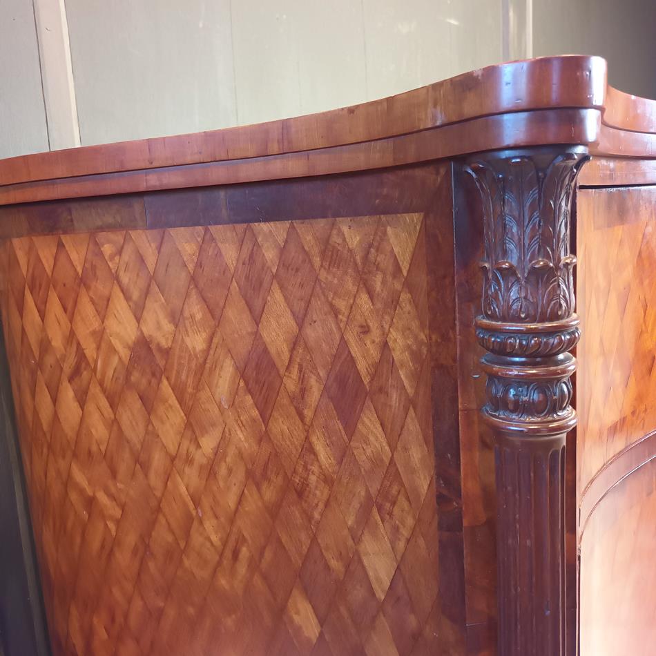 A Late 19th Century Serpentine Satinwood Commode