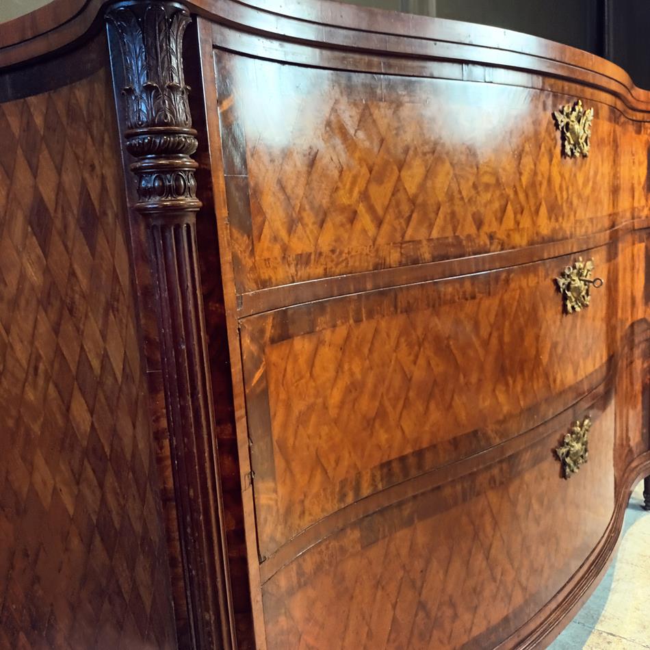 A Late 19th Century Serpentine Satinwood Commode