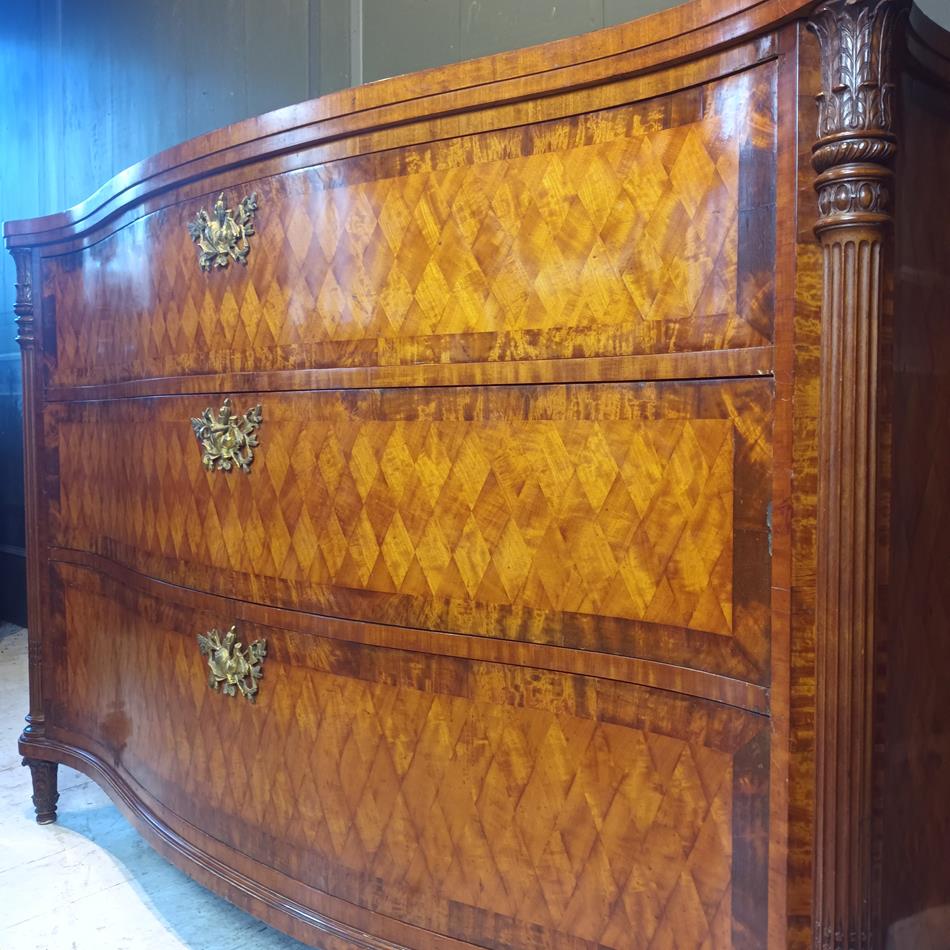 A Late 19th Century Serpentine Satinwood Commode