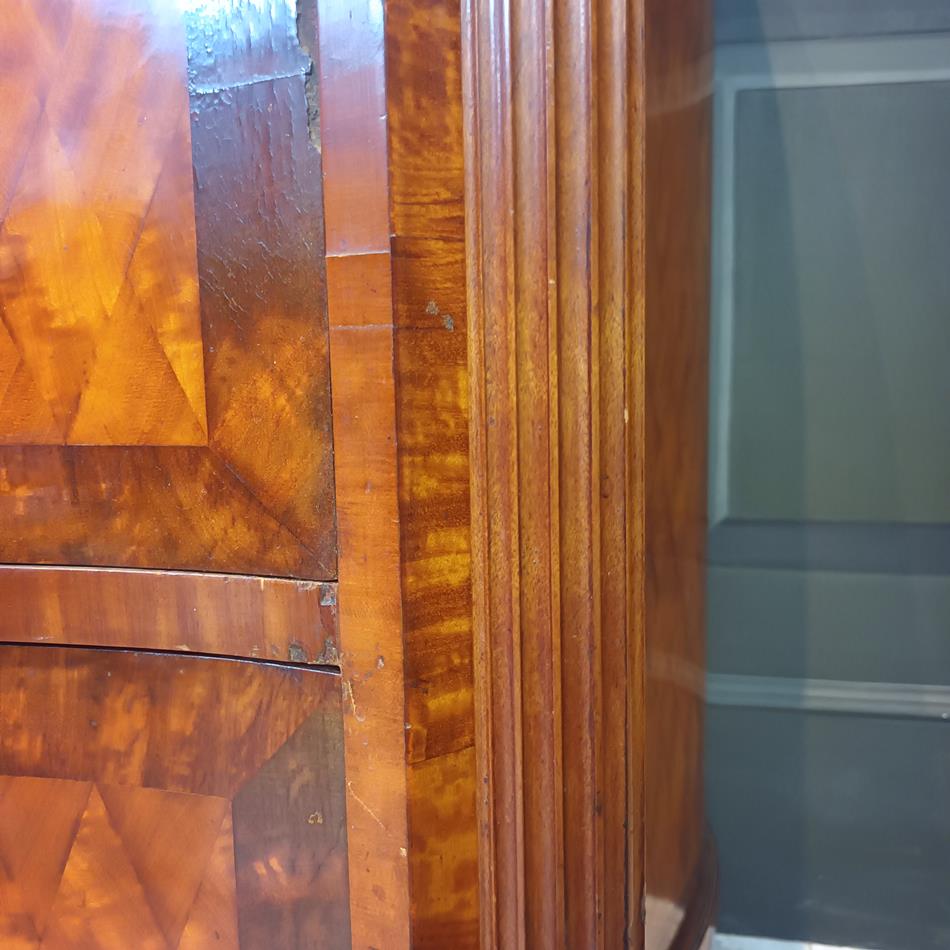 A Late 19th Century Serpentine Satinwood Commode