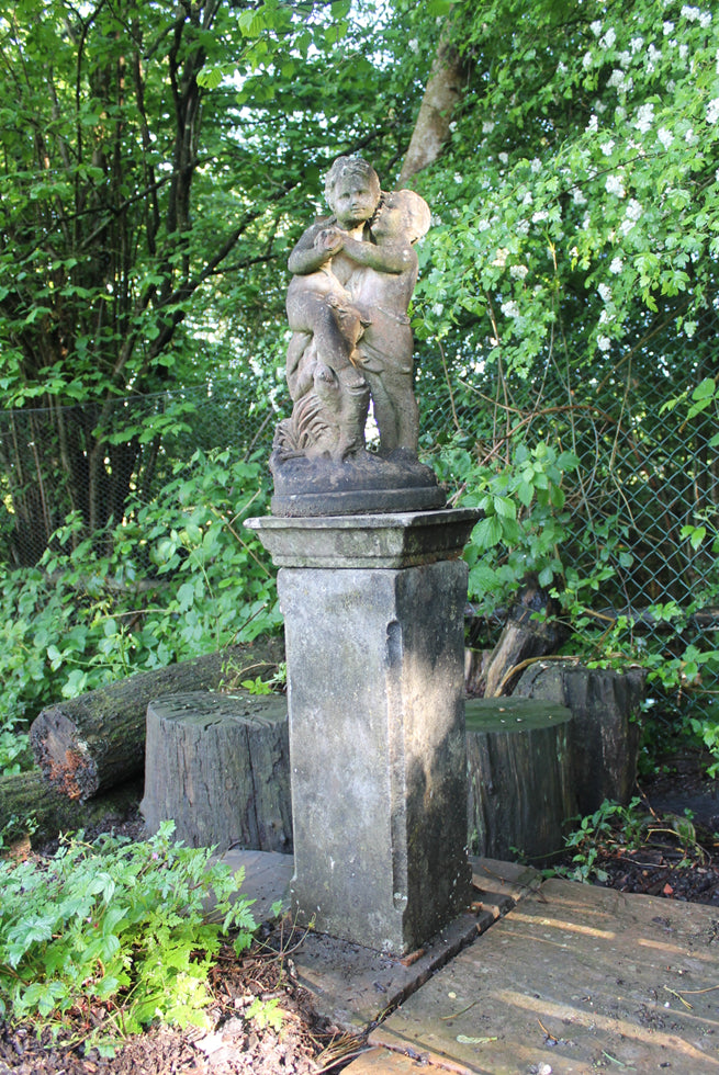 Statue Of Children On Plinth