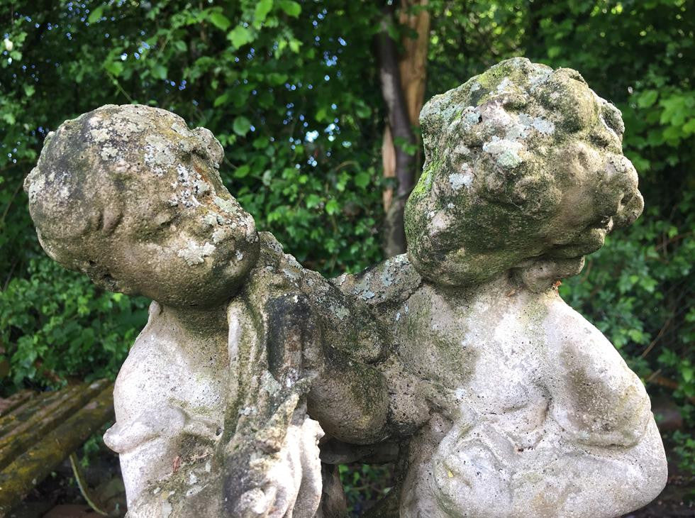 Statue Of Children On Plinth