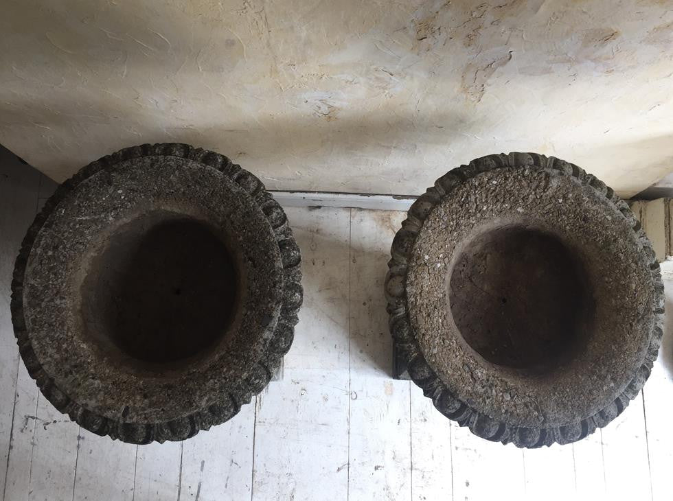 Pair of Urns On Plinths