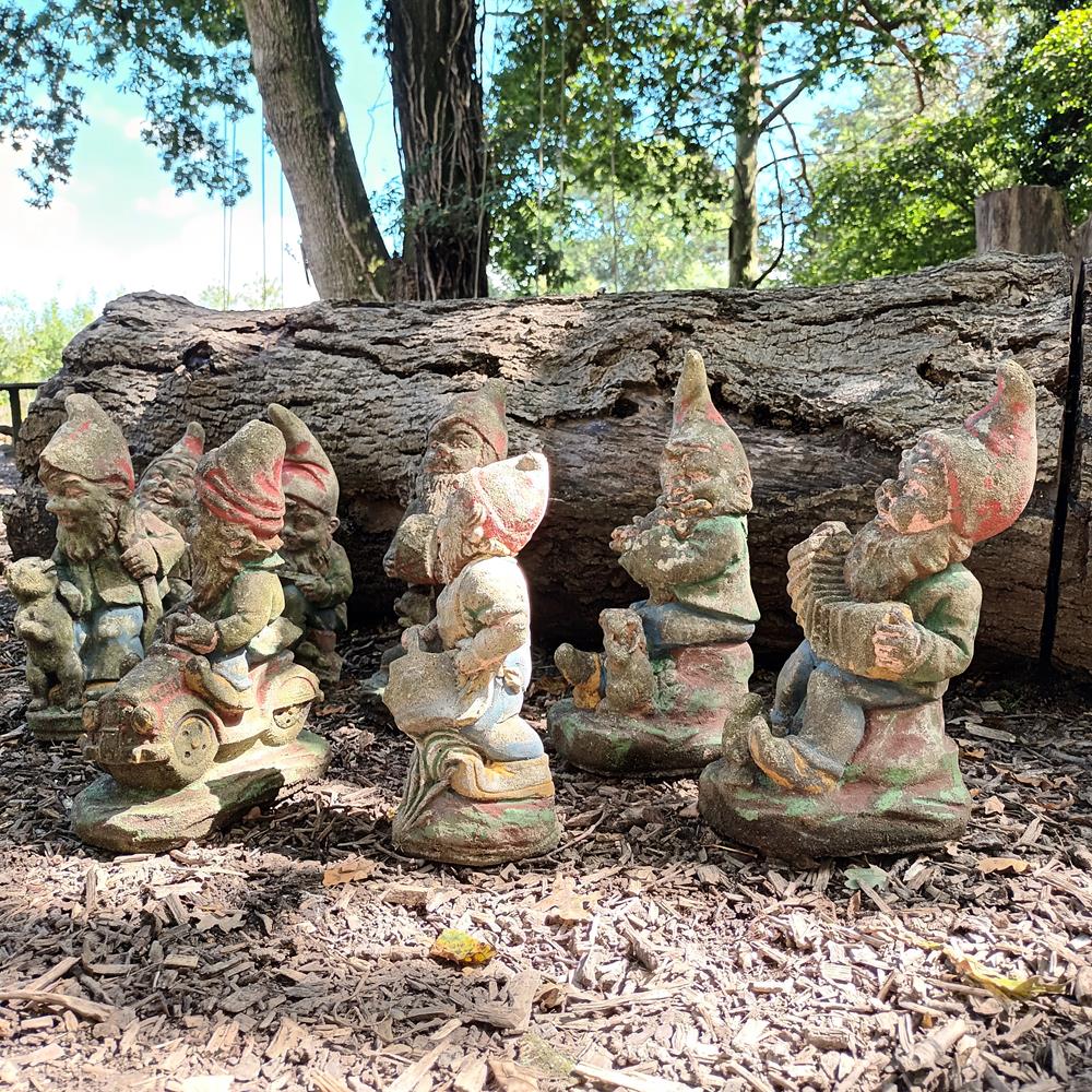 A Set Of Eight Garden Gnomes