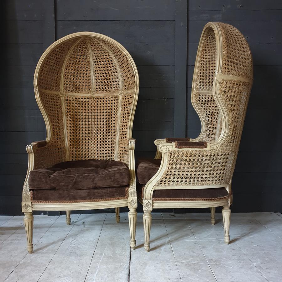 A Pair Of Caned Porters Chairs