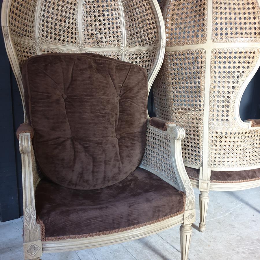 A Pair Of Caned Porters Chairs