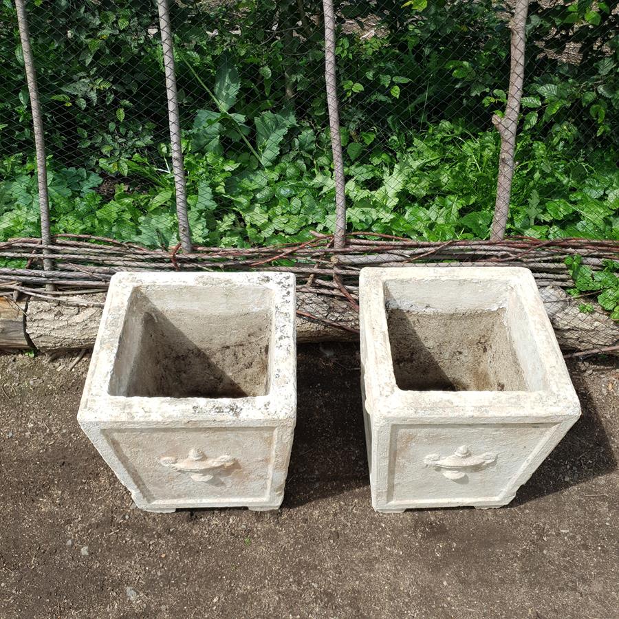 A Pair Of Stone Planters