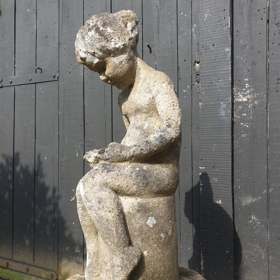 Statue Of A Sitting Girl