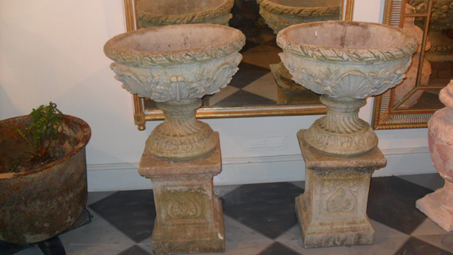 Pair Of 20th Century Composite Stone Urns On Columns