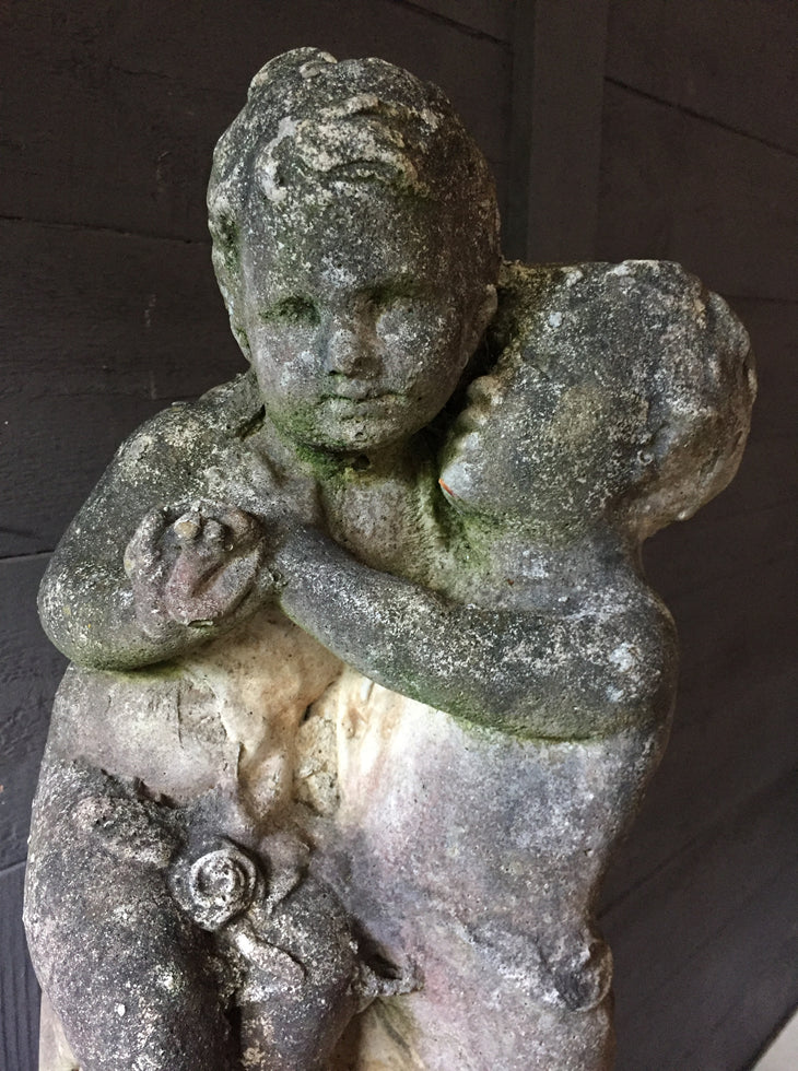 Statue Of Children On Plinth