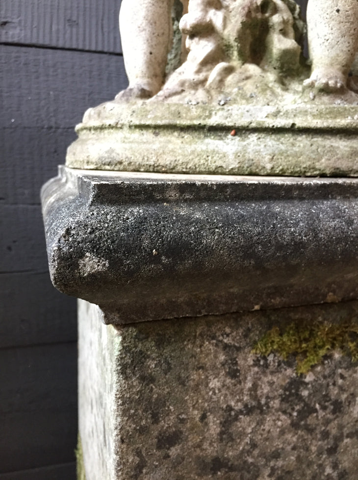 Statue Of Children On Plinth