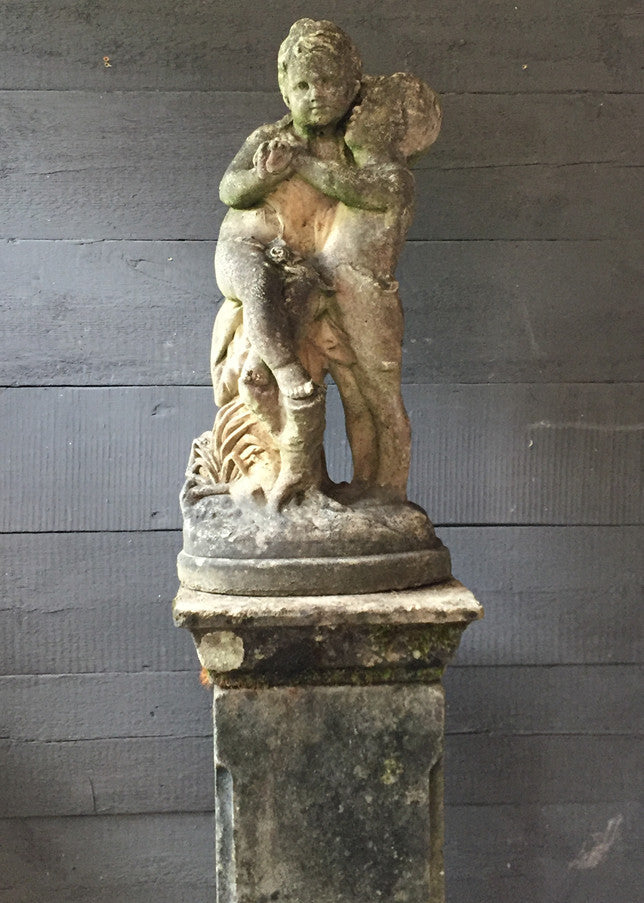 Statue Of Children On Plinth