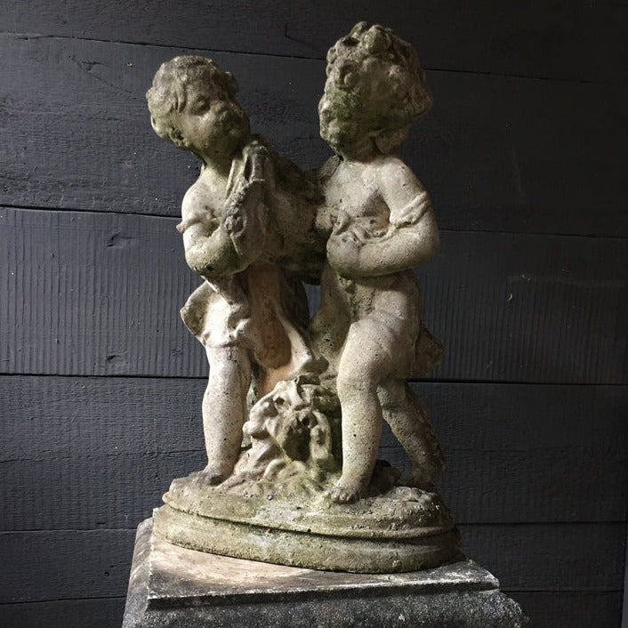 Statue Of Children On Plinth