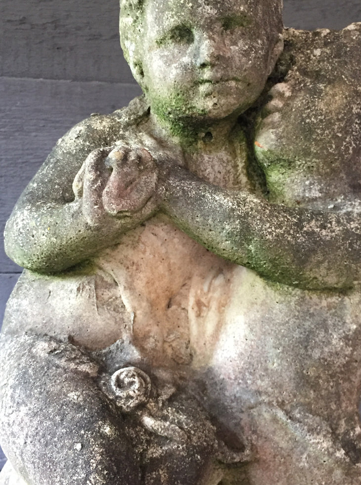 Statue Of Children On Plinth