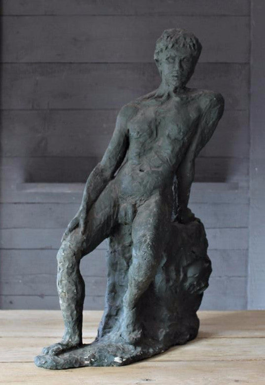 Seated Youth On Rocks Sculpture