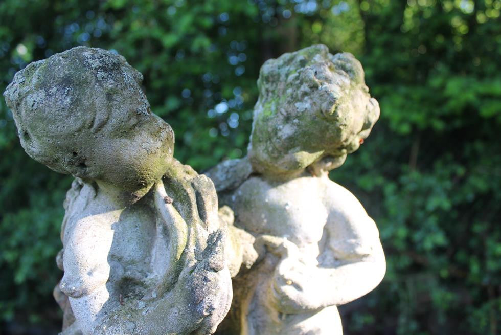 Statue Of Children On Plinth
