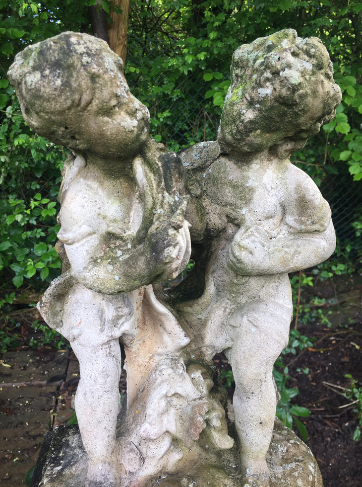 Statue Of Children On Plinth