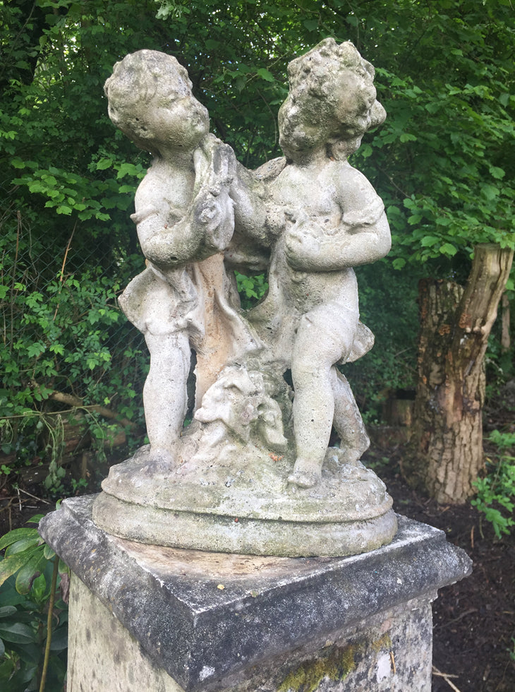 Statue Of Children On Plinth