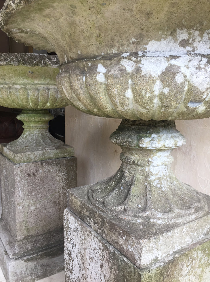 Pair of Urns On Plinths