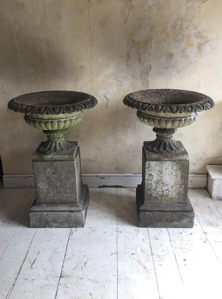 Pair of Urns On Plinths
